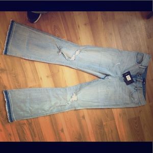 Light wash distressed denim jeans